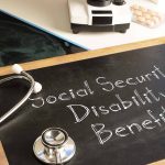 Stethoscope and chalkboard saying "Social Security Disability Benefits."