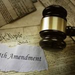 Gavel on 14th Amendment document with Constitution background