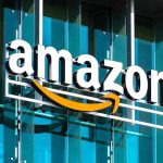 Amazon Unveils New AI Tool to Transform Your Shopping Preferences Amazon logo on a glass building facade.