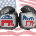 Boxing gloves with political party symbols clashing.