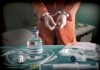 Handcuffed person near sodium thiopental and medical equipment