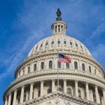 US Capitol dome with American flag flying