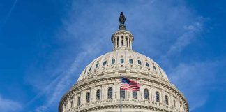 US Capitol dome with American flag flying