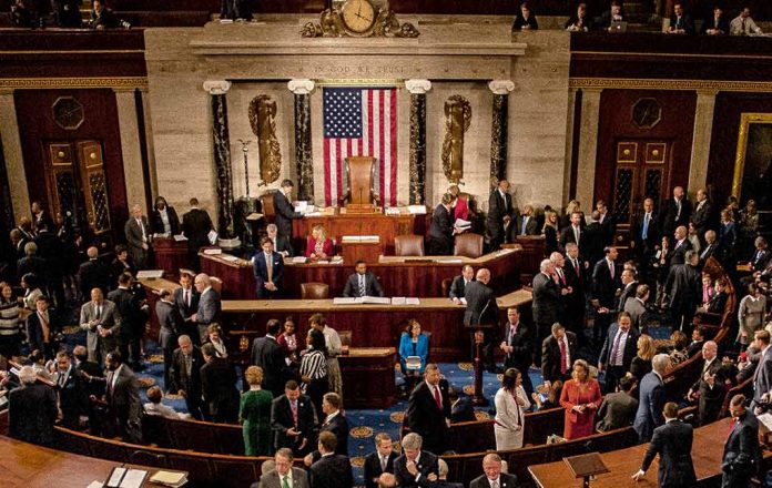 1186368265 featured image People gathering inside a government building legislative chamber