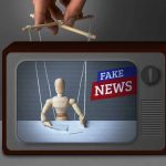 Wooden puppet manipulated on TV with fake news