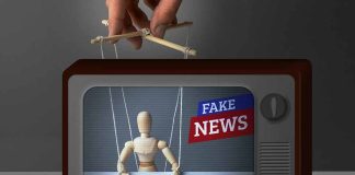 Wooden puppet manipulated on TV with fake news