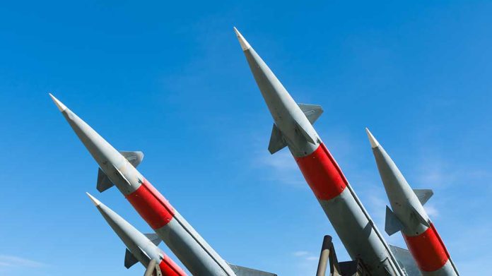 1619792353 featured image Four missiles pointing upwards under blue sky.