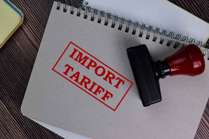 1773748721 featured image Notebook with Import Tariff stamp and rubber stamper.