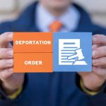 Florida AG Considers Drastic Move Against Orlando Mayor in Immigration Debate Hands holding blocks reading deportation order gavel icon