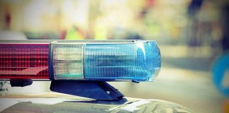 Red and blue police lights turned on.