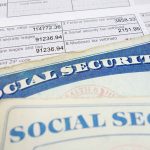 Social security cards on top of tax documents