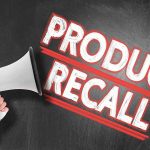 Person holding megaphone product Recall text