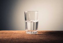 Glass of water on wooden surface