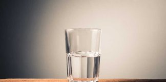 Glass of water on wooden surface