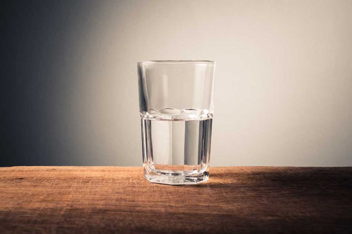 Glass of water on wooden surface