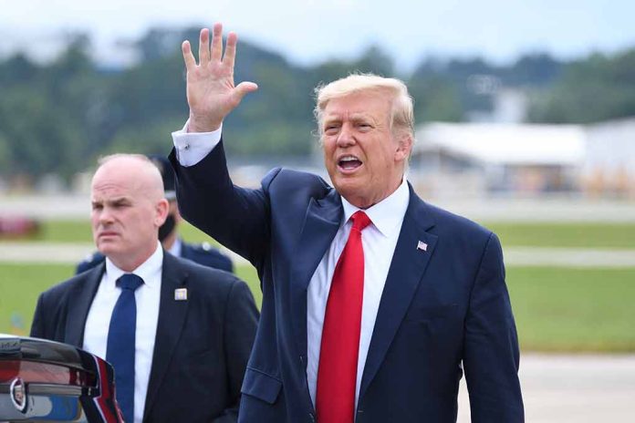 1821865589 featured image Man in suit waving while another man stands nearby