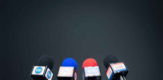 Four microphones in a row for broadcasting