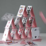 Collapsing house of cards in motion