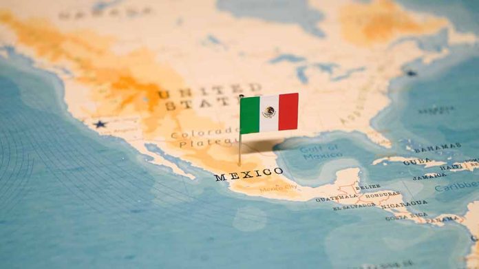 Mexican flag pin on map of Mexico