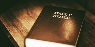 A Holy Bible on a wooden table