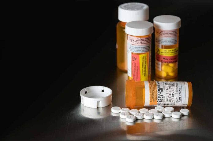 562612954 featured image Prescription medicine bottles and scattered white pills