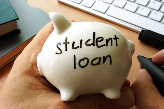 Person holding piggy bank labeled student loan