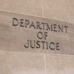 Department of Justice sign on a building