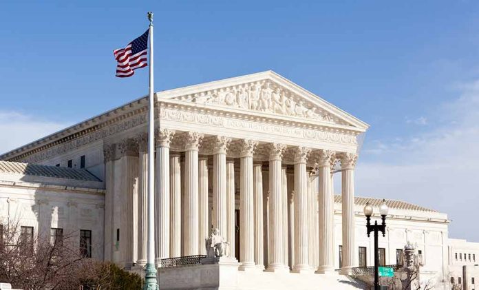 96721225 featured image United States Supreme Court building with American flag