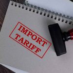 Notebook with Import Tariff stamp and rubber stamper