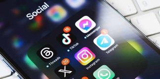 Smartphone showing social media app icons in a folder