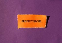 Product Recall text on orange paper, purple background