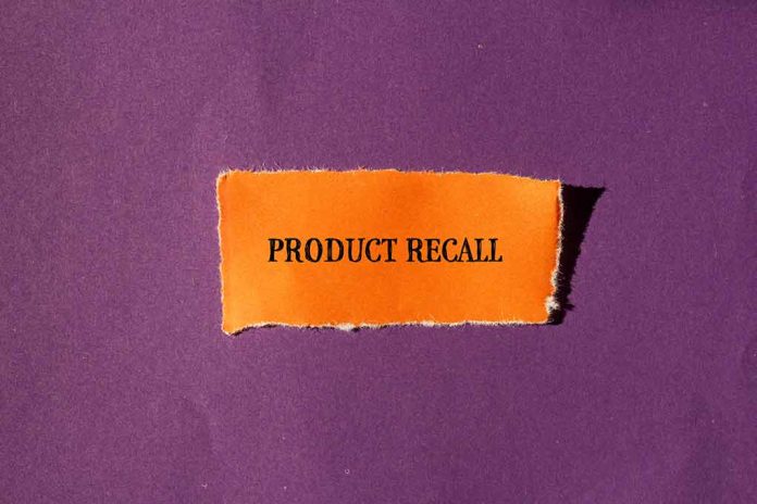 Product Recall text on orange paper, purple background