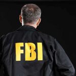 FBI agent with back facing the camera