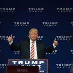 Man giving thumbs up at a Trump-Pence rally