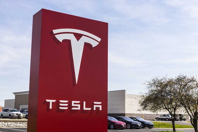 620657588 featured image Tesla sign in front of dealership