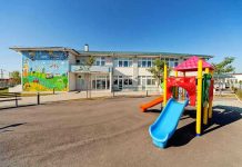 Colorful playground slide in front of a building