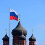 Russian flag next to church domes