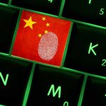 Close up of a keyboard key featuring the Chinese flag and a fingerprint