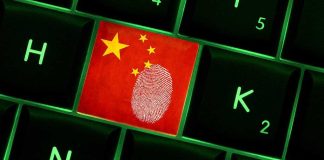 Close up of a keyboard key featuring the Chinese flag and a fingerprint