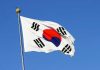 South Korean flag waving against a clear blue sky