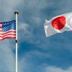 Japanese Tariff Confusion Sparks Panic USA and Japan flags flying on flagpoles