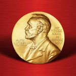 Gold Nobel Prize medal on red background.
