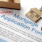 Mortgage Fraud Shocker: Senator Under Fire Approved mortgage application form with a house key and keychain