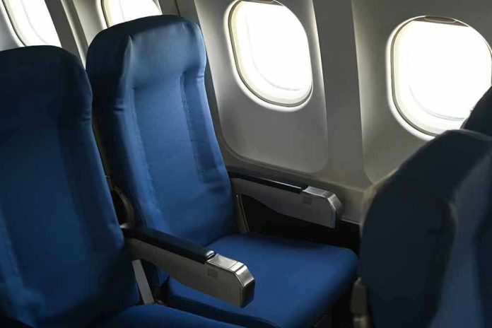 Empty airplane seats next to windows