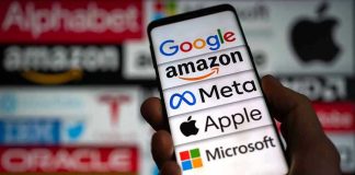 Hand holding phone displaying tech company logos