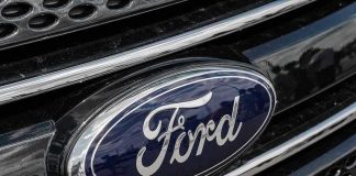 Ford logo on car grille close-up.
