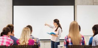 A teacher presenting to students in a classroom