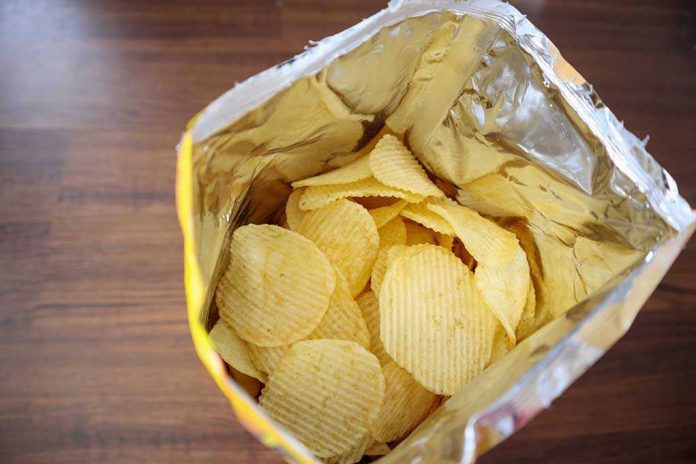 Open bag of ridged potato chips