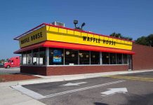 Exterior view of a Waffle House restaurant with bright yellow signage