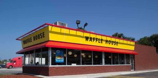 Exterior view of a Waffle House restaurant with bright yellow signage
